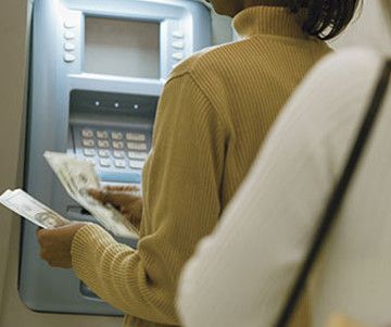 woman withdrawing from atm